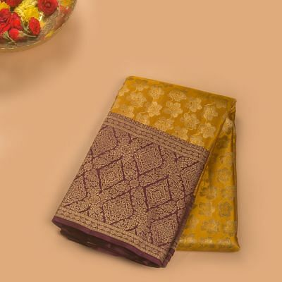 Taranga Kanchi Silk Tissue Jaal Yellow Saree