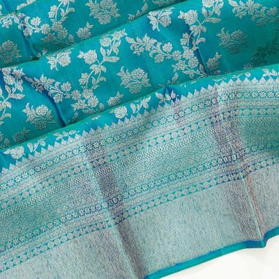 Kanchipuram Silk Antique Zari Jaal And Butta Teal Blue Saree