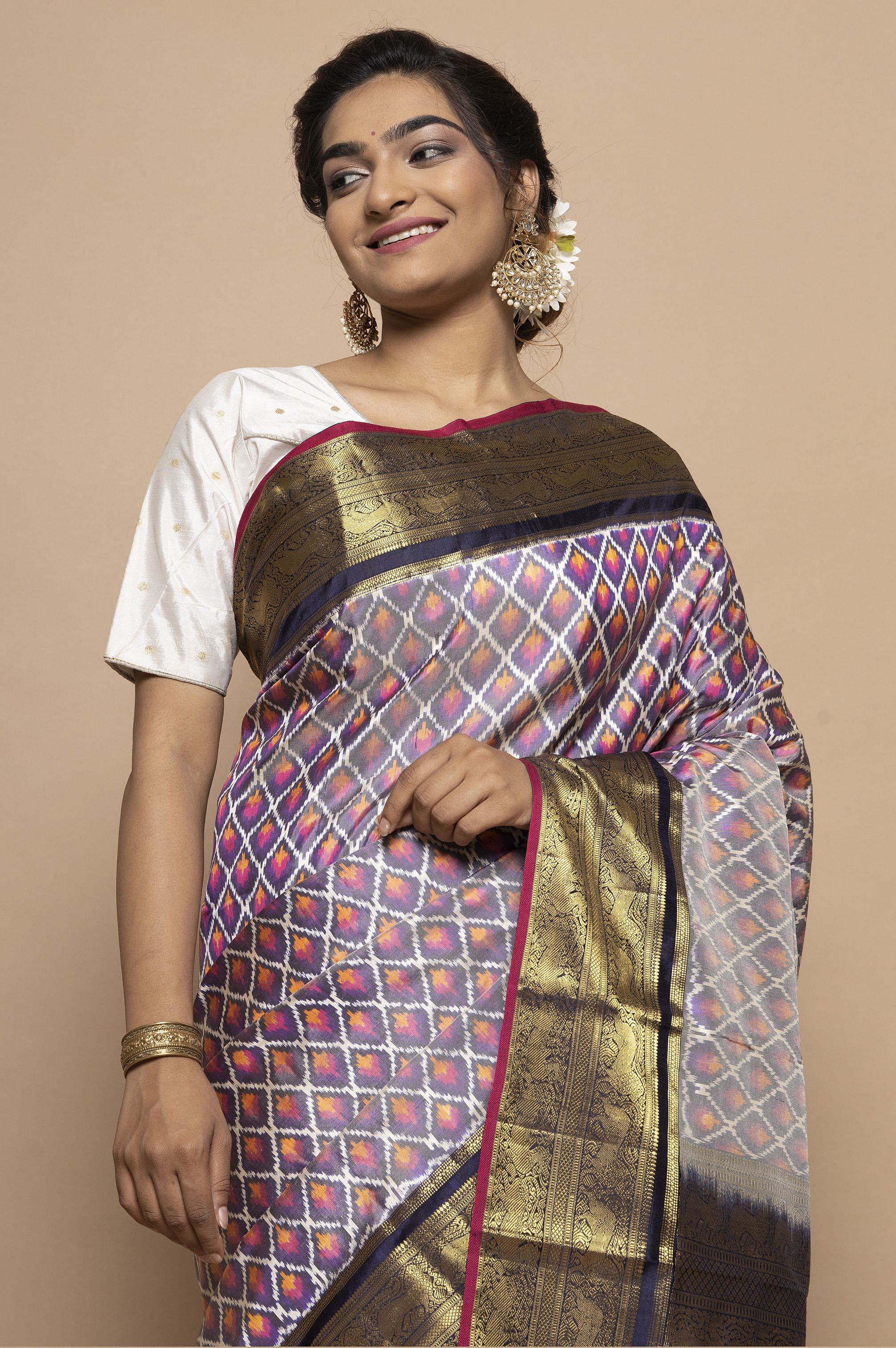 Pochampally ikkat gray with pink handwoven pure silk saree in floral design